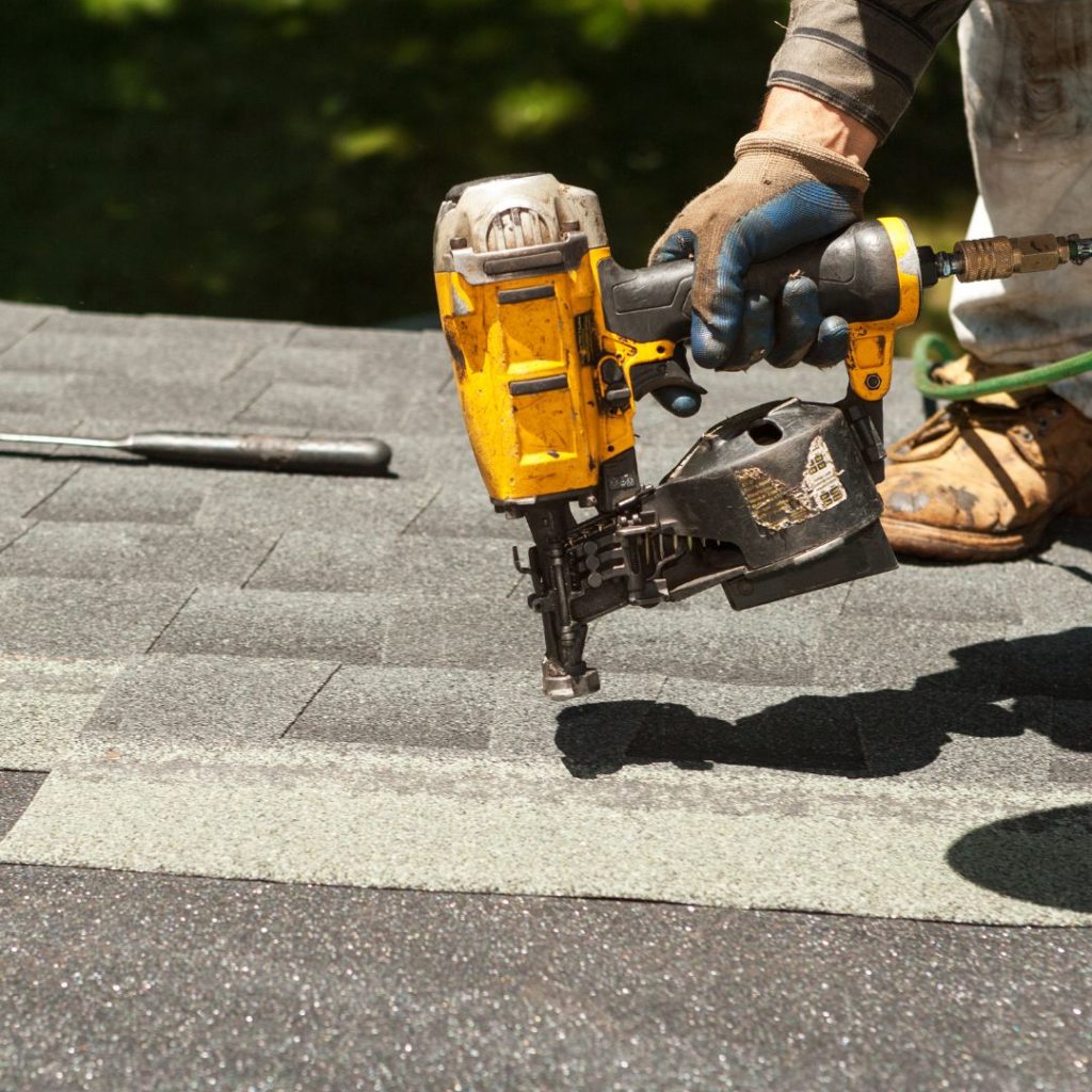 img of someone working on a roof
